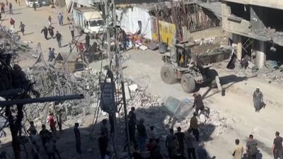 Gaza Residents Clear Rubble After Israeli Airstrikes