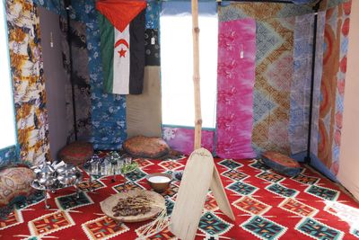 The Tent That Carries Voices Across Borders Where Its People Cannot Travel